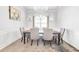 Formal dining room offers elegant seating and a modern chandelier, perfect for Gathering gatherings at 4580 Cloister Cir, Hampton, GA 30228