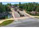 Picturesque community entrance with ponds, water features, landscaping, and stone detailing on bridge and gatehouse at 4580 Cloister Cir, Hampton, GA 30228