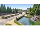 Scenic gated community entrance with lush landscaping, water features, and stone detailing at 4580 Cloister Cir, Hampton, GA 30228