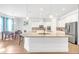 Spacious kitchen featuring white cabinetry, stainless steel appliances, and granite counters at 4580 Cloister Cir, Hampton, GA 30228