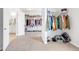 Large walk-in closet with built-in storage and access to an en-suite bathroom at 4580 Cloister Cir, Hampton, GA 30228
