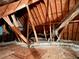 Unfinished attic space showing wood framing and insulation with ductwork at 925 Wynn Rd, Mcdonough, GA 30252