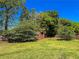 Spacious backyard featuring a wooden shed and a well-maintained lawn at 925 Wynn Rd, Mcdonough, GA 30252