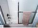 Bathroom featuring a shower and tub combination with sliding glass door at 925 Wynn Rd, Mcdonough, GA 30252