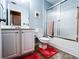 Bathroom with vanity, toilet, and shower-tub combination with glass doors at 925 Wynn Rd, Mcdonough, GA 30252