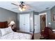 Comfortable bedroom featuring a ceiling fan, closet, and a view to an additional room at 925 Wynn Rd, Mcdonough, GA 30252
