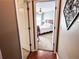 Through the doorway, a bedroom features a ceiling fan, bed, side table, and a window at 925 Wynn Rd, Mcdonough, GA 30252