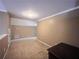 Bonus room features neutral walls, plush carpeting, and ample space at 925 Wynn Rd, Mcdonough, GA 30252