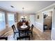 Dining area with a round table and wooden buffet, with a view of a closet at 925 Wynn Rd, Mcdonough, GA 30252