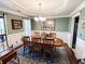 Traditional dining room with trey ceiling, table, and windows with natural light and classic decor at 925 Wynn Rd, Mcdonough, GA 30252
