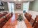 Traditional dining room features wood table, natural light from two windows and decorative shelving unit at 925 Wynn Rd, Mcdonough, GA 30252