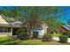 Charming home showcasing the garage, a well-maintained lawn and a basketball hoop at 925 Wynn Rd, Mcdonough, GA 30252