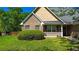 Beautiful brick home with a well-maintained lawn, attractive siding, and inviting front porch at 925 Wynn Rd, Mcdonough, GA 30252