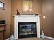 Cozy living room featuring a classic fireplace with decorative accents and mantel at 925 Wynn Rd, Mcdonough, GA 30252