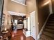 Inviting foyer with hardwood floors, high ceilings, coat rack and a view into the cozy living room at 925 Wynn Rd, Mcdonough, GA 30252