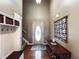 Welcoming foyer with hardwood floors, hall tree, and decorative wall art at 925 Wynn Rd, Mcdonough, GA 30252