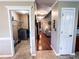 Hallway view showing access to the laundry room and an overview of the home's interior layout at 925 Wynn Rd, Mcdonough, GA 30252