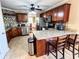 Open kitchen layout with stainless appliances, a breakfast bar and an adjacent dining area at 925 Wynn Rd, Mcdonough, GA 30252