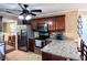 A beautifully designed kitchen area with seating, stainless appliances, and a view to a sunny dining space at 925 Wynn Rd, Mcdonough, GA 30252