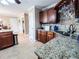 Updated kitchen with stainless appliances, granite countertops, tile backsplash and access to multiple rooms at 925 Wynn Rd, Mcdonough, GA 30252