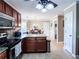 Open kitchen with stainless steel appliances, tile floor, and a breakfast nook at 925 Wynn Rd, Mcdonough, GA 30252