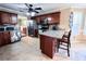 Open kitchen with stainless steel appliances, tile floor, and a breakfast bar at 925 Wynn Rd, Mcdonough, GA 30252