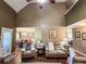 Spacious living room with high ceilings, hardwood floors, neutral paint and comfortable furniture at 925 Wynn Rd, Mcdonough, GA 30252