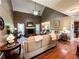 Spacious living room with a vaulted ceiling, fireplace, ceiling fan, and hardwood floors at 925 Wynn Rd, Mcdonough, GA 30252