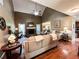 Spacious living room with a vaulted ceiling, fireplace, ceiling fan, and hardwood floors at 925 Wynn Rd, Mcdonough, GA 30252