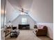 Cozy living room with vaulted ceilings, ceiling fan, and comfortable seating at 925 Wynn Rd, Mcdonough, GA 30252
