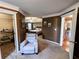 Relaxing main bedroom suite featuring a seating area, tray ceilings, and ensuite bath access at 925 Wynn Rd, Mcdonough, GA 30252