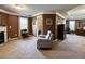 Spacious main bedroom suite featuring a seating area, ensuite bath access, and fireplace at 925 Wynn Rd, Mcdonough, GA 30252