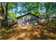 Lush backyard featuring mature trees, offering plenty of shade and privacy at 1430 Fairbanks Sw St, Atlanta, GA 30310