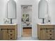 Elegant bathroom featuring double vanities with modern sinks and beautiful mirrors at 1430 Fairbanks Sw St, Atlanta, GA 30310