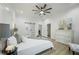 Bedroom featuring a sliding glass door to a bathroom and a beautiful accent chair at 1430 Fairbanks Sw St, Atlanta, GA 30310