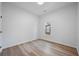Empty bedroom with new floors, a window and freshly painted walls, ready for personalization at 1430 Fairbanks Sw St, Atlanta, GA 30310