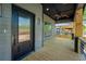 Inviting front porch with modern door, stylish lighting, wood floors, and ceiling fan at 1430 Fairbanks Sw St, Atlanta, GA 30310