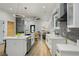 Bright open kitchen with stainless appliances, breakfast bar, and modern finishes throughout at 1430 Fairbanks Sw St, Atlanta, GA 30310