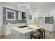Modern kitchen featuring white cabinets, a kitchen island and modern hanging lights at 1430 Fairbanks Sw St, Atlanta, GA 30310