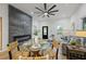 Open floor plan showcasing the living room, dining area, and modern fireplace with kitchen view at 1430 Fairbanks Sw St, Atlanta, GA 30310