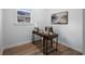 Small office space featuring a modern desk, accent art and wood flooring at 1430 Fairbanks Sw St, Atlanta, GA 30310