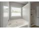 Bathroom with large soaking tub and glass shower at 2656 Staunton Ln, Duluth, GA 30096