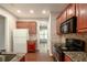Kitchen with stainless steel appliances, granite countertops, and cherry cabinets at 2656 Staunton Ln, Duluth, GA 30096