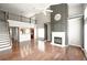 Spacious living room with fireplace, hardwood floors, and a view of the kitchen at 2656 Staunton Ln, Duluth, GA 30096