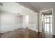 Elegant dining room with hardwood floors, chandelier, and wainscotting at 2656 Staunton Ln, Duluth, GA 30096