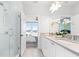 Bright bathroom with a glass shower, double sink vanity and a view into the bedroom at 332 Gibson Se St, Atlanta, GA 30316