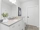 Clean bathroom with white cabinetry, grey flooring, and modern fixtures at 332 Gibson Se St, Atlanta, GA 30316