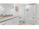 Contemporary bathroom with white cabinets, a shower-tub combo and a sleek vanity at 332 Gibson Se St, Atlanta, GA 30316