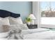 Tastefully decorated bedroom featuring soft lighting, a modern nightstand, and a comfortable bed at 332 Gibson Se St, Atlanta, GA 30316