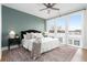 Inviting bedroom with large windows, a ceiling fan, and modern furnishings for comfort at 332 Gibson Se St, Atlanta, GA 30316